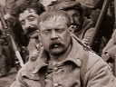 A unit of older reservists or territorials takes a short rest during a march, 1916.