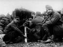 A crew operates a 37 mm gun.