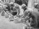 A row of Cellerier mortars -- improvised using spent artillery rounds affixed to wood sabots.