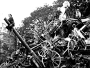 A post-war shot of the victory celebration on 14 July 1919 showing piles of confiscated German guns.