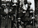 Infantrymen of the 23rd Co., 210th RI in the mountainous Vosges wearing large sheepskin jerkins to card against the frigid temperatures. (March 1915)