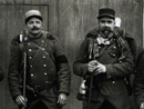 A group of old territorials, poorly equipped and armed with obsolete Gras rifles but stalwart nonetheless. One wears a mourning arm band. (1914)