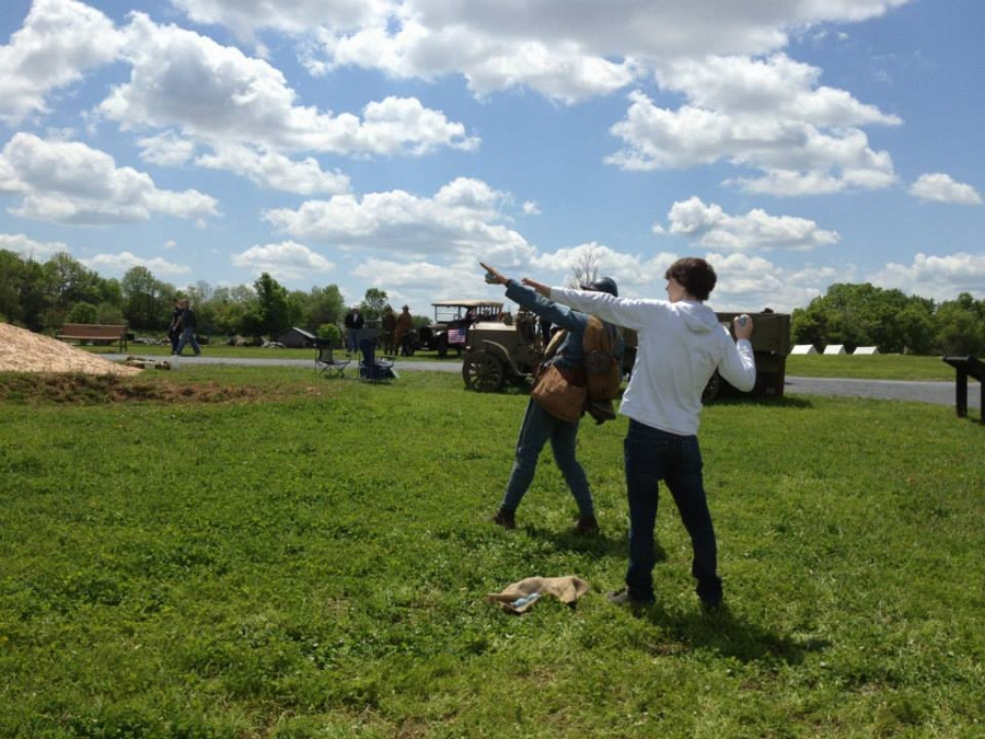 Sdt. Nicolas demonstrates the proper grenade throwing technique to a member of the public.