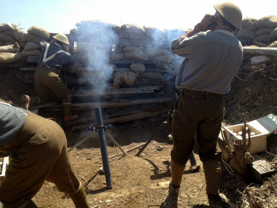 A Canadian mortar team firing high-explosive rounds on the German positions, November 2014. 