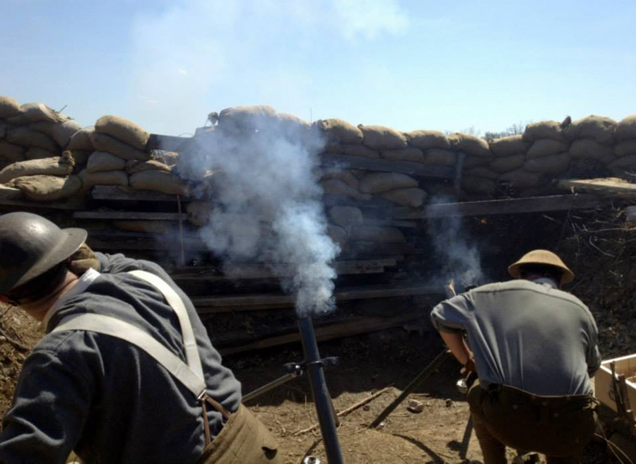 A Canadian mortar team firing high-explosive rounds on the German positions, November 2014.