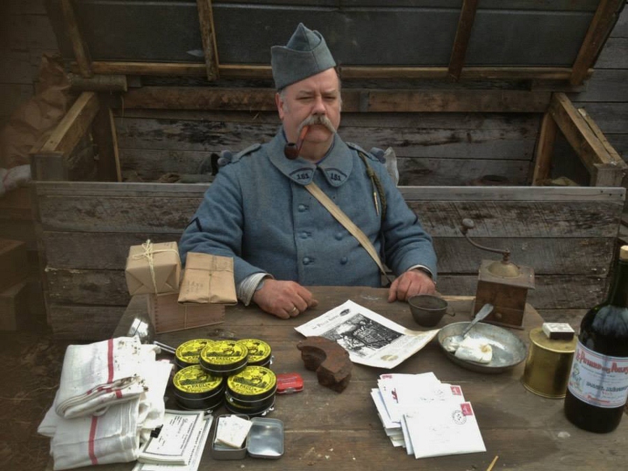 Sdt. Maillard lords over his supplies of shoe polish, towels, and mail, November 2014