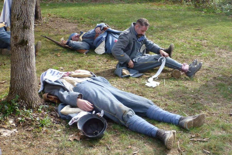 Sgt. Contamine uses a bayonet scabbard as a brace awaits care at the Canadian field hospital, November 2014