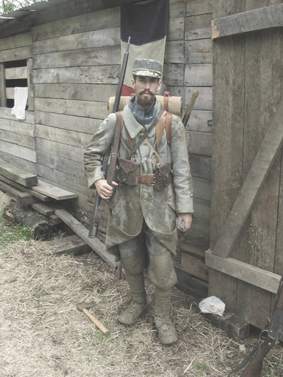 Sgt. Contamine poses in front of the unit's bunker, June 2004.