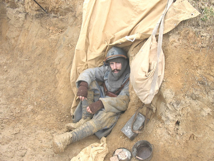 Sgt. Contamine in a small shelter dug into trench wall - Newport News, VA, March 2005