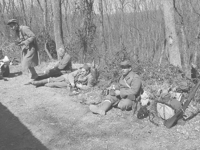 The unit relaxes over the morning mess--beef and vegetable stew, bread and coffee. April 2005