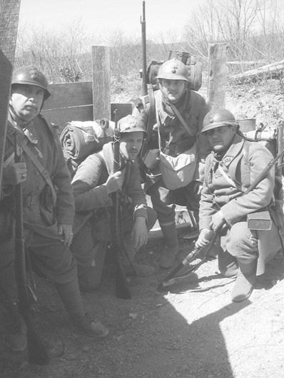 Sdts. Fluery, Schech, Bracken and Cpl. Picard, as the unit arrives in the trenches, April 2005.