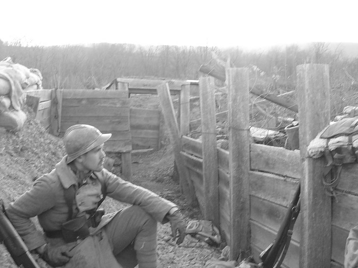 Sdt. Schech rests in the trench, April 2005.