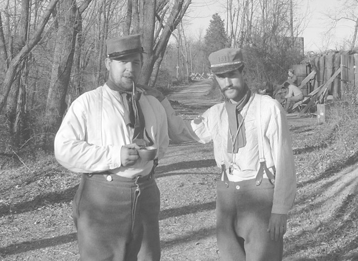 Cpl. Picard and Sgt. Contamine at rest in the rear, April 2005.