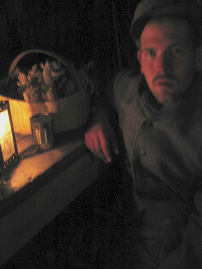Sdt. Schech takes a moment to warm up in the bunker, April 2005.