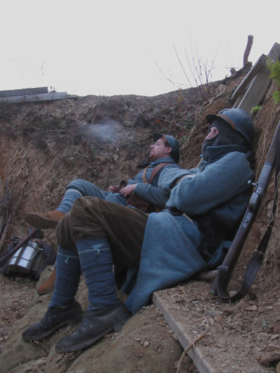 Sdt. Studer tries to get some more rest as Cpl. Picard starts his day with a nice pipe, November 2005.