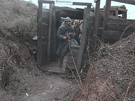 Sgt. Contamine holding down a conquered German trench in an attack under a driving rain, April 2006.