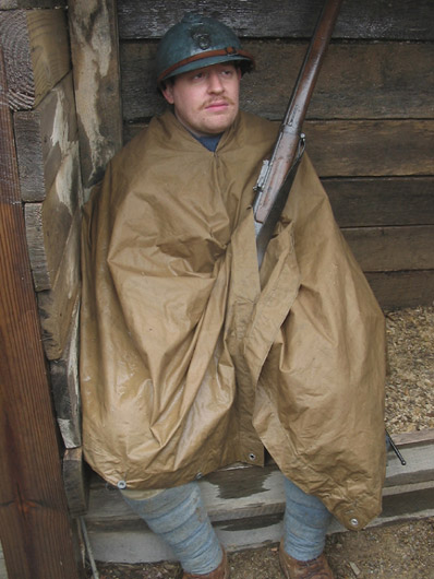 Cpl. Mathieu Picard tries to get out of the cold rain, April 2006.