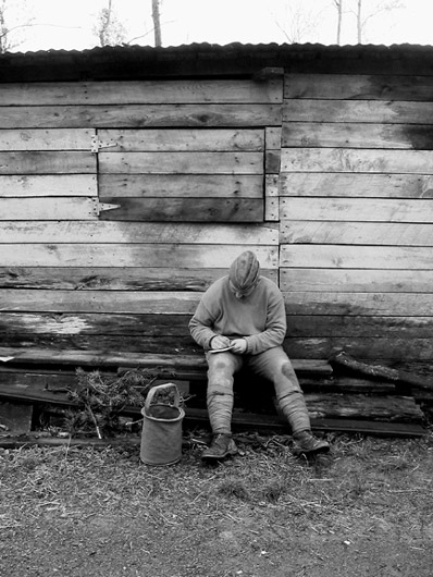 Sdt. Convard fills out a post card to his friends back home, April 2006.