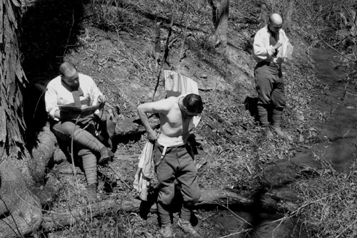 Picard unwinds with the paper as Contamine and  Martin wash up in a stream, April 2007.