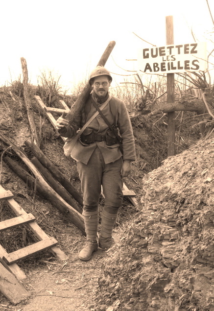 Soldat Schech brings up a log for revetting, passing a sign that reads 