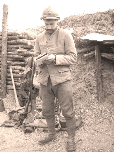 Sgt. Contamine filling out reports on the unit's supplies and ammo at stand-to, April 2008.