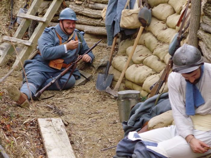 Sgt. Contamine sewing buttons back on his trousers in a revealing moment, April 2008.