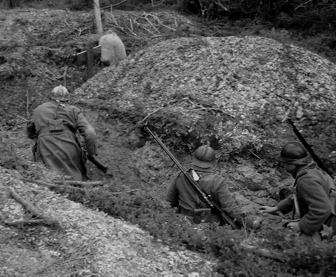 Poilus demonstrate to American trainees how to progress through a trench using hand grenades, April 2010