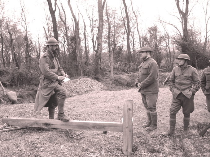 Sgt. Contamine discusses with American trainees the procedure for clearing an enemy trench using hand grenades, April 2010.