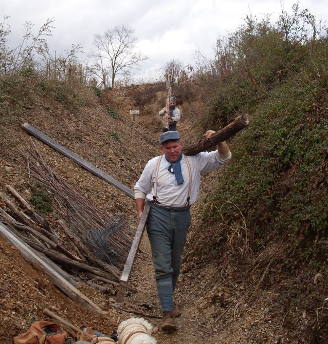 Bringing up logs to be used for trench wall revetments, Nov. 2010.