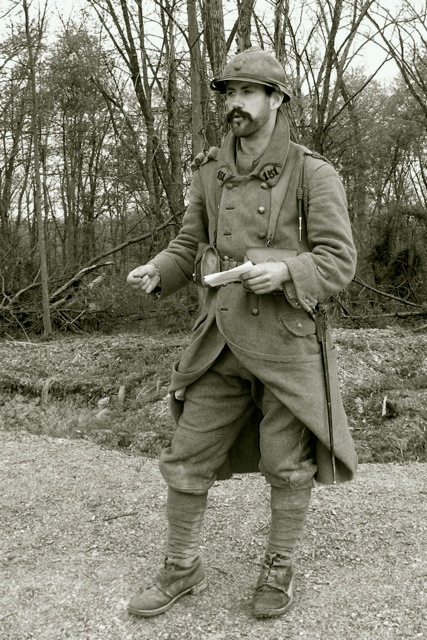 Sgt. Contamine discusses with American trainees how to progress through a trench using hand grenades, April 2010