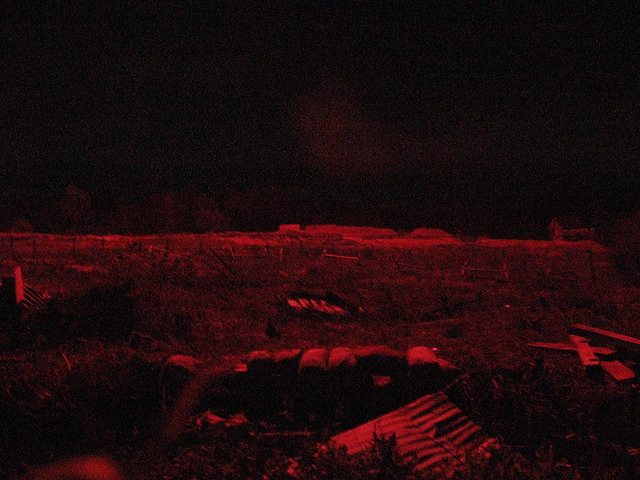 A flare illuminates no-man's-land, November 2010.