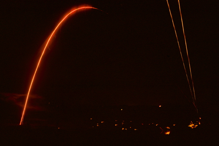 Flares arch over a fire-fight. Taken by Garret Miller, April 2010.