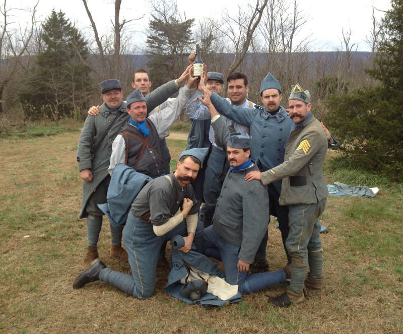 The French soccer team holds aloft their trophy: a bottle of champagne. Nov. 2012.