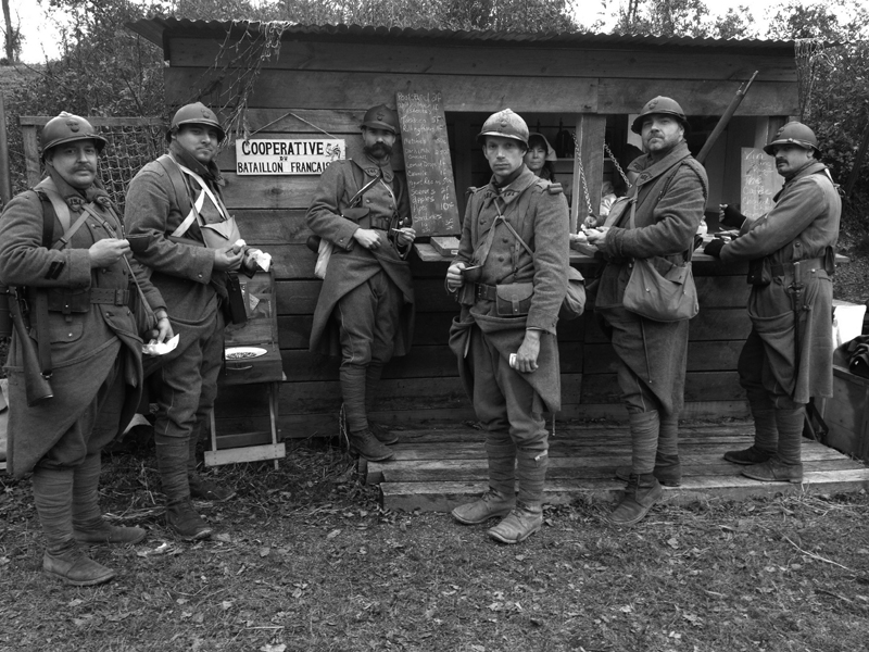 A group of soldats spend their francs judiciously at the French company co-op shop, Nov. 2012.