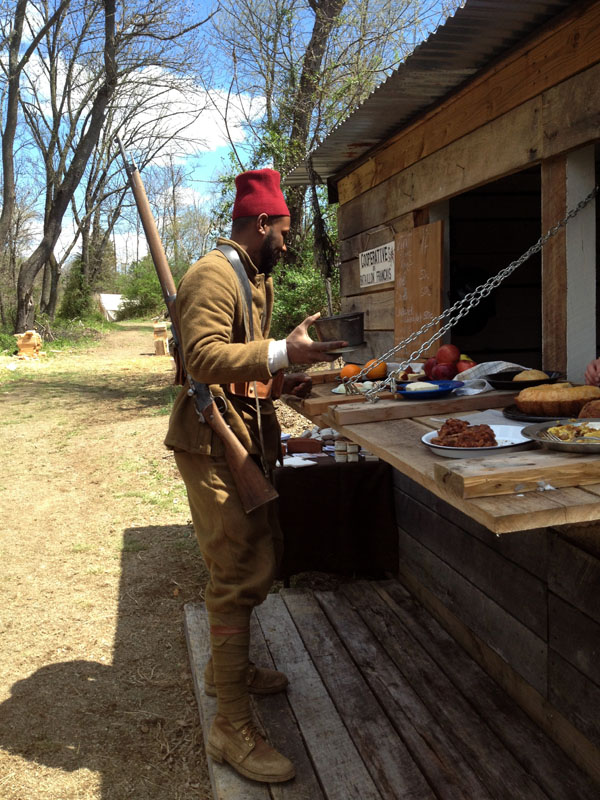 A tirailleur shops for items at the Co-operative du Bataillon Francais. Newville, April 2013.