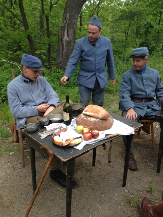 Sdt. Kratz discusses cloth with Sdt. Nicolas and Sdt. Broussard. French company work weekend. Newville, September 2013.