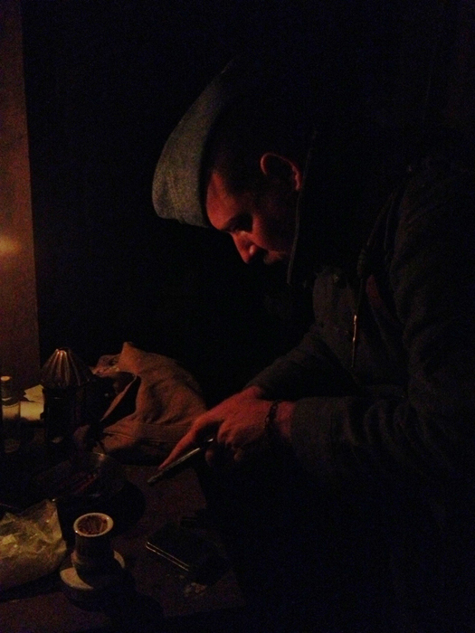 Cpl. Picard cleans his Ruby pistol for the next day's action. Newville, November 2013.