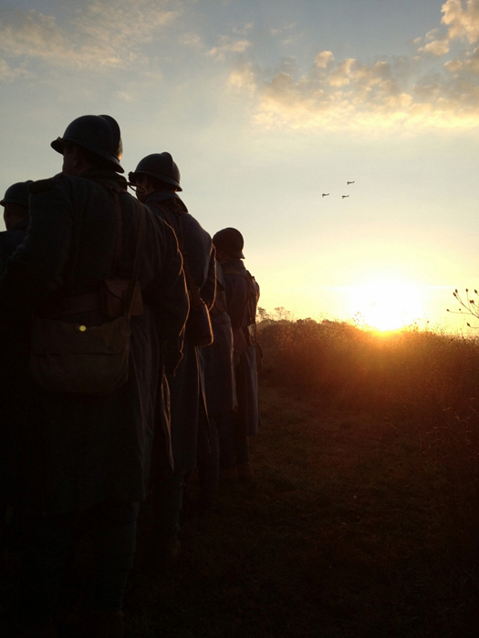 A formation of planes flies over a dawn formation of the Allied battalion. Newville, November 2013.