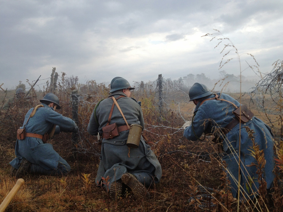 Repairing wire under the cover of a smoke screen. Newville, November 2013.