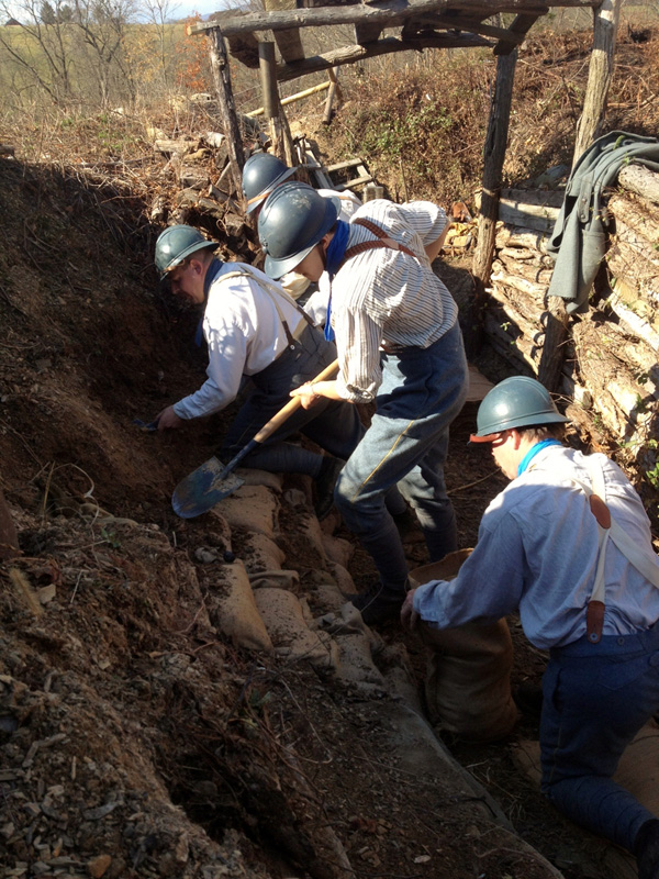 Members of the 151 repairing a trench wall. Newville, November 2013.
