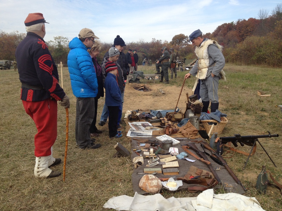 Sdt. Nicolas in 1915 corduroy ersatz kit and sheepskin jerkin, speaks to the public about the French infantry kit. Old Bethpage Restoration Village, NY, November 2013.