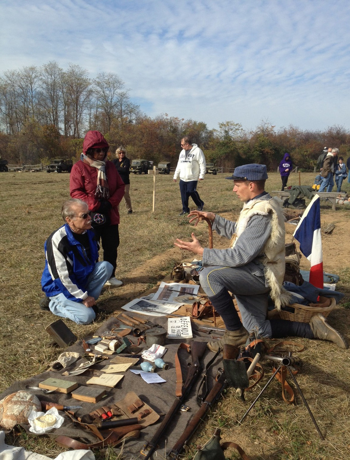 Sdt. Nicolas in 1915 corduroy ersatz kit and sheepskin jerkin, speaks to the public about the French infantry kit. Old Bethpage Restoration Village, NY, November 2013.