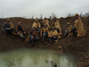 Members of the 18e RI and 151e RI in a shell-hole, December 1914.