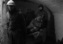 Brancardiers carry a wounded victim to the first-aid post, Fort Mifflin, March 2015.