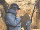 Sdt. Studer, small shelter of logs with sod roof - Newport News, VA, March 2005