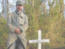 Sgt. Contamine stands beside the unit's newly erected memorial to the French soldiers of the Great War. The cross is inscribed: 