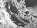 Sgt. Contamine in a small shelter dug into trench wall - Newport News, VA, March 2005 
