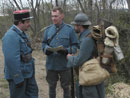 Sgt. Contamine reporting the status of the unit to Capt. William and Lt. Hauser from Battalion staff before heading up to the line, April 2006.