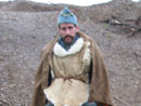 Sgt. Jean Contamine tries to stay warm and dry after a miserable wet night, April 2006.