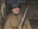 Cpl. Mathieu Picard tries to get out of the cold rain, April 2006.